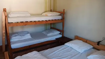 Un ou plusieurs lits dans un hébergement de l'établissement Appartement confortable à La Bresse avec terrasse