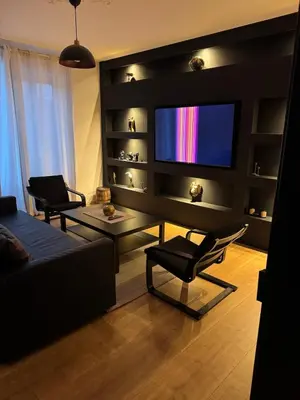 Télévision ou salle de divertissement dans l'établissement Apartment de standing