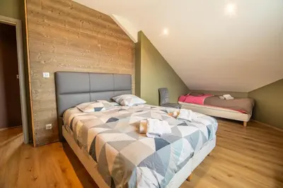 Un ou plusieurs lits dans un hébergement de l'établissement Chalet Horizon 200 m2 Jacuzzi et Sauna