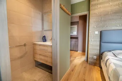 Un ou plusieurs lits dans un hébergement de l'établissement Chalet Horizon 200 m2 Jacuzzi et Sauna