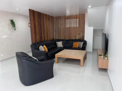 Coin salon dans l'établissement Maison cosy 6 pers Proche Europa-Park
