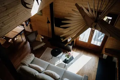 Coin salon dans l'établissement Chalet à 5 minutes de Gérardmer avec étang