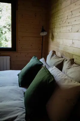 Un ou plusieurs lits dans un hébergement de l'établissement Chalet à 5 minutes de Gérardmer avec étang