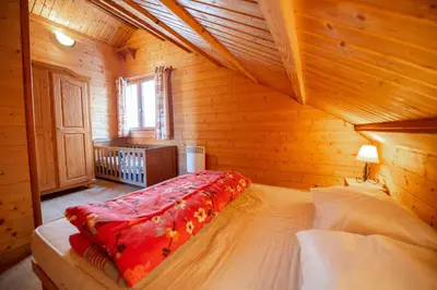 Un ou plusieurs lits dans un hébergement de l'établissement Chalet Maëlle - Évasion Nature à Gérardmer