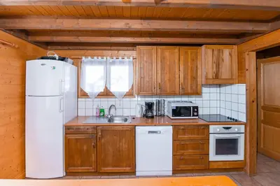 Cuisine ou kitchenette dans l'établissement Chalet Maëlle - Évasion Nature à Gérardmer
