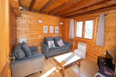 Coin salon dans l'établissement Chalet Maëlle - Évasion Nature à Gérardmer