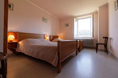 Un ou plusieurs lits dans un hébergement de l'établissement Gîte Jonquille