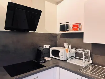 Cuisine ou kitchenette dans l'établissement La Vallée d Anna