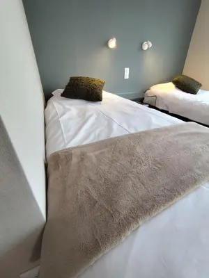 Un ou plusieurs lits dans un hébergement de l'établissement Le loft de la Tour - Appartement 3P prox Centre