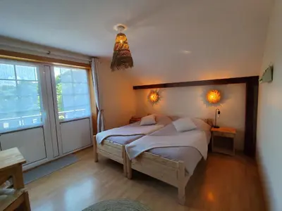 Un ou plusieurs lits dans un hébergement de l'établissement LA MAISON Crêperie-Bar-Hôtel