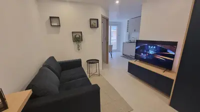 Télévision ou salle de divertissement dans l'établissement Le Malibu