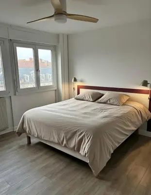 Un ou plusieurs lits dans un hébergement de l'établissement Appartement Porte Jeune - 3 Chambres Balcon Fibre Netflix