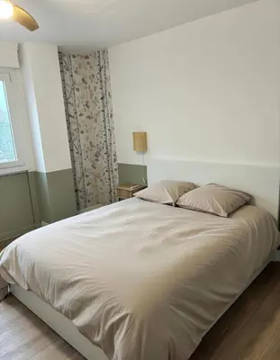Un ou plusieurs lits dans un hébergement de l'établissement Appartement Porte Jeune - 3 Chambres Balcon Fibre Netflix