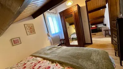 Un ou plusieurs lits dans un hébergement de l'établissement Le Chalet des 4 Chouettes