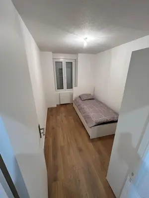 Un ou plusieurs lits dans un hébergement de l'établissement Renove Comfortable Appartement Mulhouse