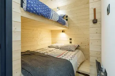 Un ou plusieurs lits dans un hébergement de l'établissement Lodge Belle Hutte - Proche des Pistes