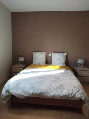 Un ou plusieurs lits dans un hébergement de l'établissement La Maison Bleue