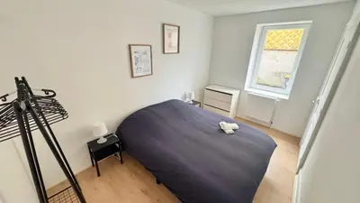Un ou plusieurs lits dans un hébergement de l'établissement Cosy 3 - Belfort centre