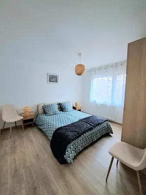 Un ou plusieurs lits dans un hébergement de l'établissement Appartement cosy Colmar centre avec parking