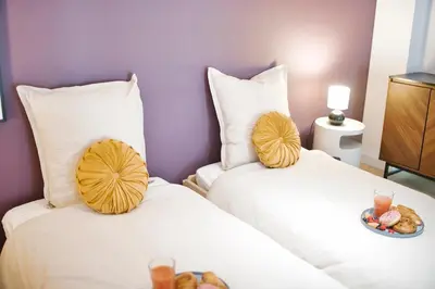 Un ou plusieurs lits dans un hébergement de l'établissement The Purple Suite - Duplex - Mulhouse Center