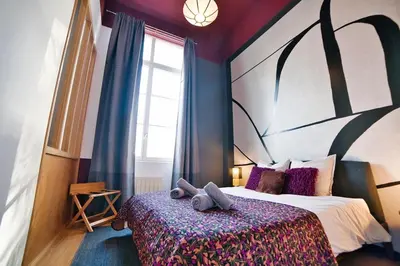 Un ou plusieurs lits dans un hébergement de l'établissement The Purple Suite - Duplex - Mulhouse Center