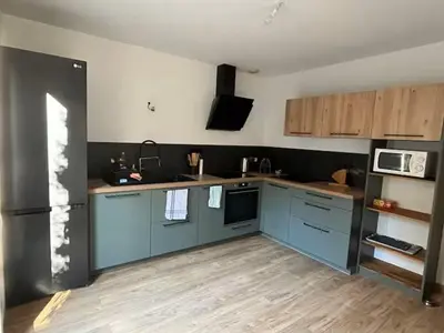 Cuisine ou kitchenette dans l'établissement Le refuge de la fée