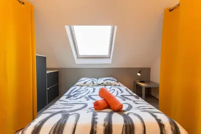 Un ou plusieurs lits dans un hébergement de l'établissement Le clos Serenity - Jardin & parking