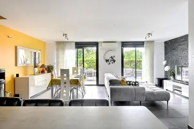 Coin salon dans l'établissement FAA'mily Home - 3 bedrooms