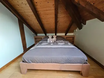 Un ou plusieurs lits dans un hébergement de l'établissement appartement le petit chalet sauna