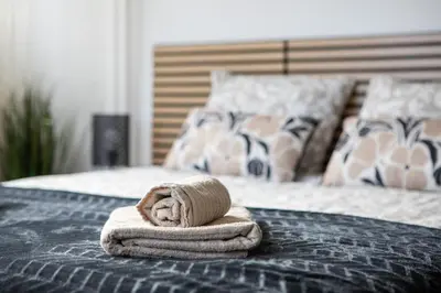 Un ou plusieurs lits dans un hébergement de l'établissement L'Eden Appart, Fibre, Garage, Balcon, Calme et Cosy