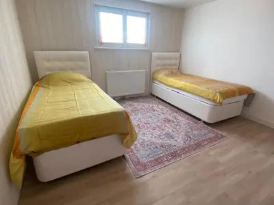 Un ou plusieurs lits dans un hébergement de l'établissement Cozy ground floor apartment