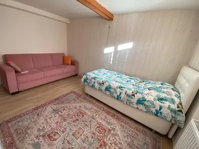 Un ou plusieurs lits dans un hébergement de l'établissement Cozy ground floor apartment
