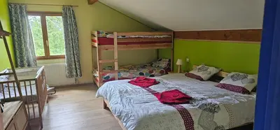 Un ou plusieurs lits dans un hébergement de l'établissement La ferme rose