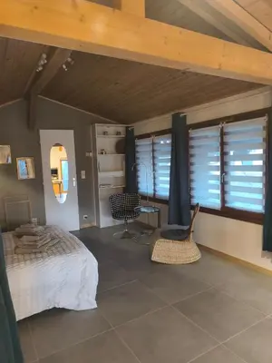 Un ou plusieurs lits dans un hébergement de l'établissement La chambre d'hôtes du facteur d'orgues