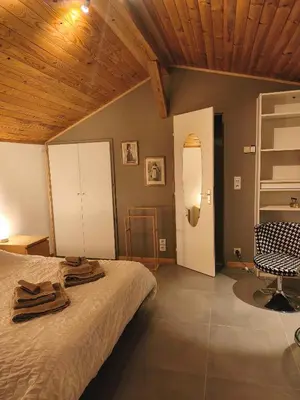 Un ou plusieurs lits dans un hébergement de l'établissement La chambre d'hôtes du facteur d'orgues