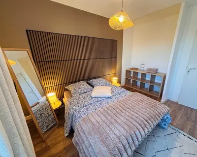 Un ou plusieurs lits dans un hébergement de l'établissement L'appartement du Château