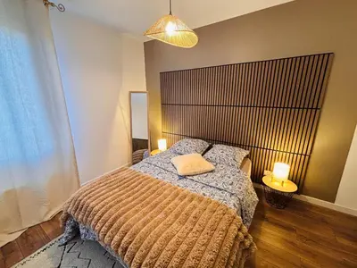 Un ou plusieurs lits dans un hébergement de l'établissement L'appartement du Château
