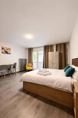 Un ou plusieurs lits dans un hébergement de l'établissement Studio Premium Hyper-Centre, Parking Gratuit, Aux Portes de Bâle
