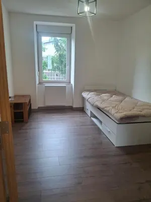 Un ou plusieurs lits dans un hébergement de l'établissement Appartement T3 conviviale avec terrasse
