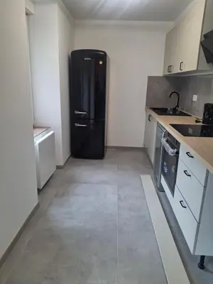 Cuisine ou kitchenette dans l'établissement Appartement T3 conviviale avec terrasse