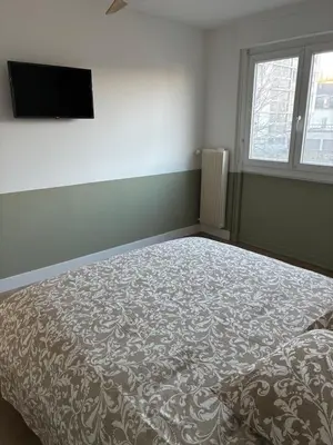 Un ou plusieurs lits dans un hébergement de l'établissement Chez nous Mulhouse - Hyper Centre - Parking - Balcon - Netflix