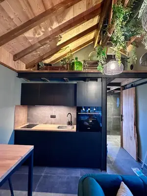 Cuisine ou kitchenette dans l'établissement Le Chalet de Lise et son bain nordique
