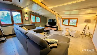 Télévision ou salle de divertissement dans l'établissement Chalet de la Mexel Gerardmer