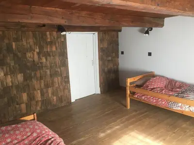 Un ou plusieurs lits dans un hébergement de l'établissement Ferme vosgienne cosy