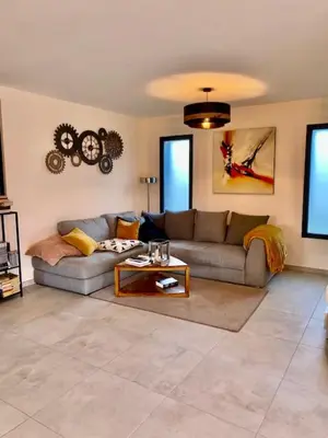 Coin salon dans l'établissement Chambre chez l'habitant
