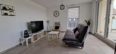 Télévision ou salle de divertissement dans l'établissement Le gîte des maraîchers