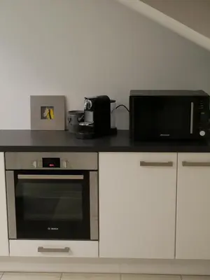 Cuisine ou kitchenette dans l'établissement Le Clocher, nice warm and comfortable nest