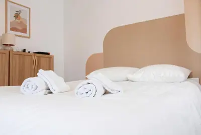Un ou plusieurs lits dans un hébergement de l'établissement Chic Home - Turckheim