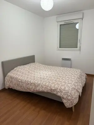 Un ou plusieurs lits dans un hébergement de l'établissement Appartement calme et lumineux