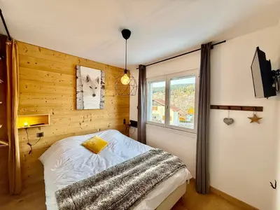 Un ou plusieurs lits dans un hébergement de l'établissement Chalet Altitude Evasion, au cœur des Vosges